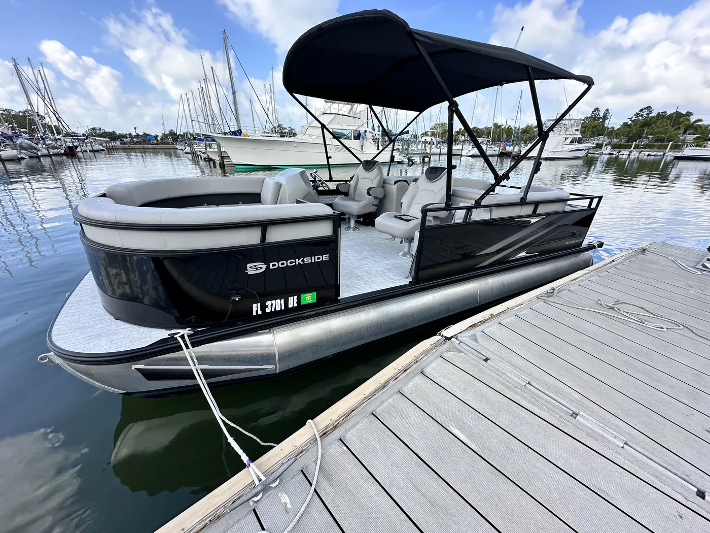 The 2026 TriToon pontoon tied alongside the dock at the City of Gulfport Municipal Marina