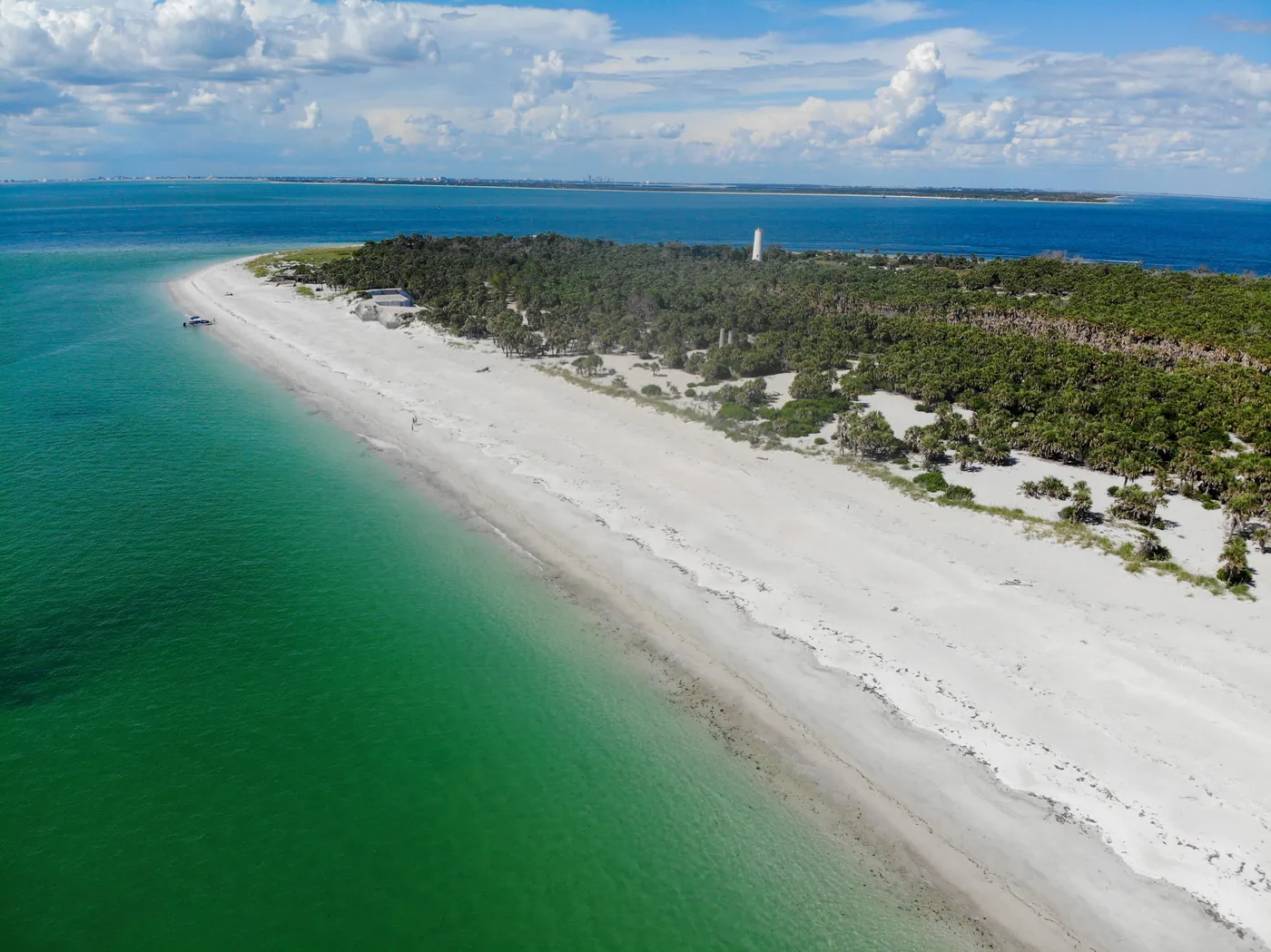 Aerial view of the Egmont Key shoreline where white sand meets clear green Gulf water
