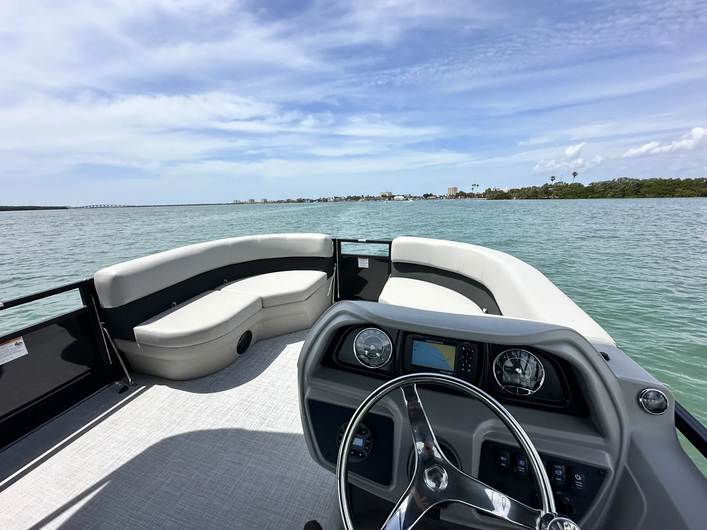 View forward from the pontoon helm toward a beach on Boca Ciega Bay